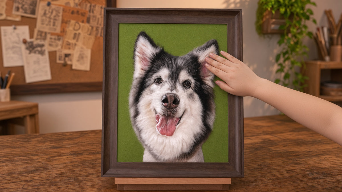 Framed needle-felted husky portrait on easel in a workshop setting
