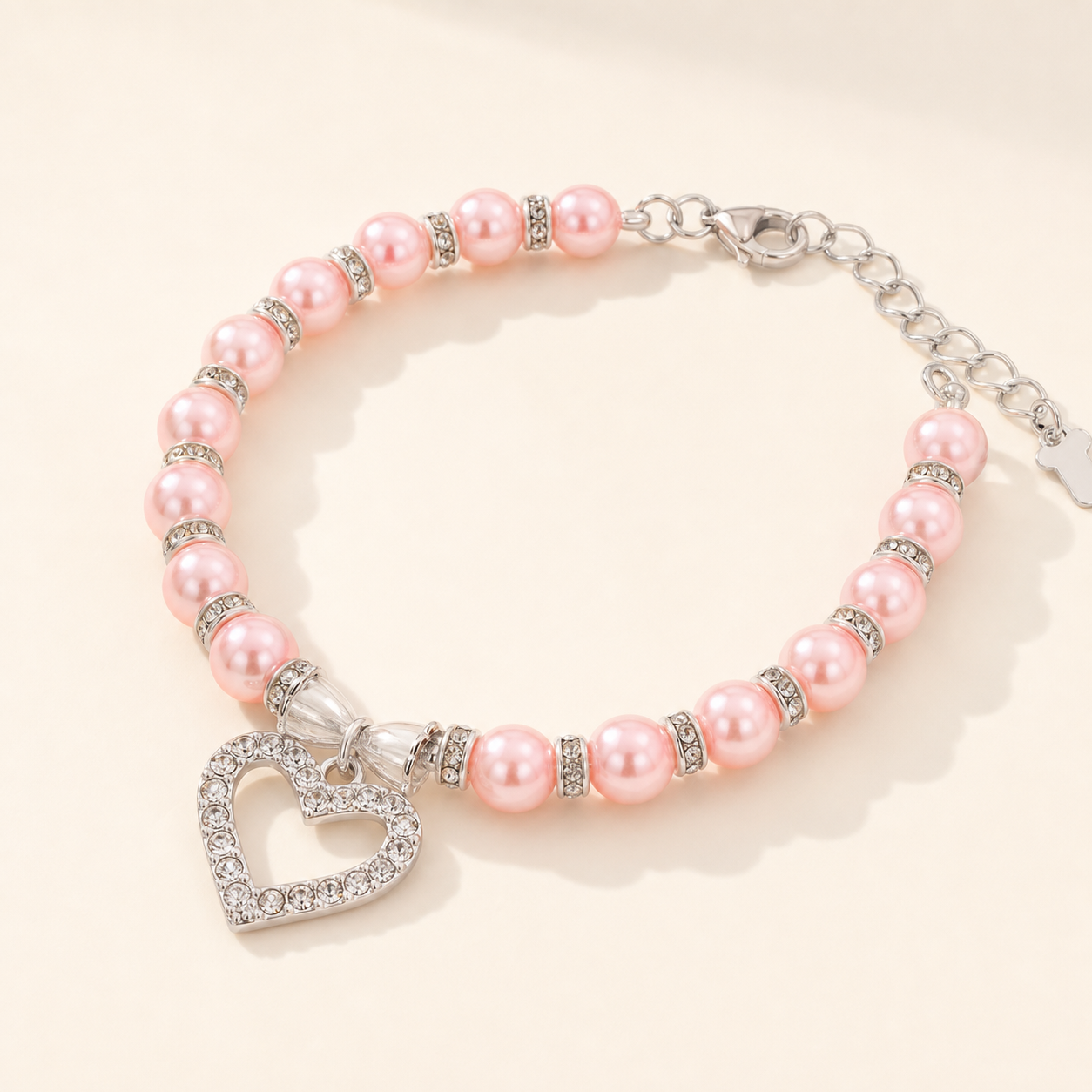 Pink beaded pet necklace with crystal-style heart, product view